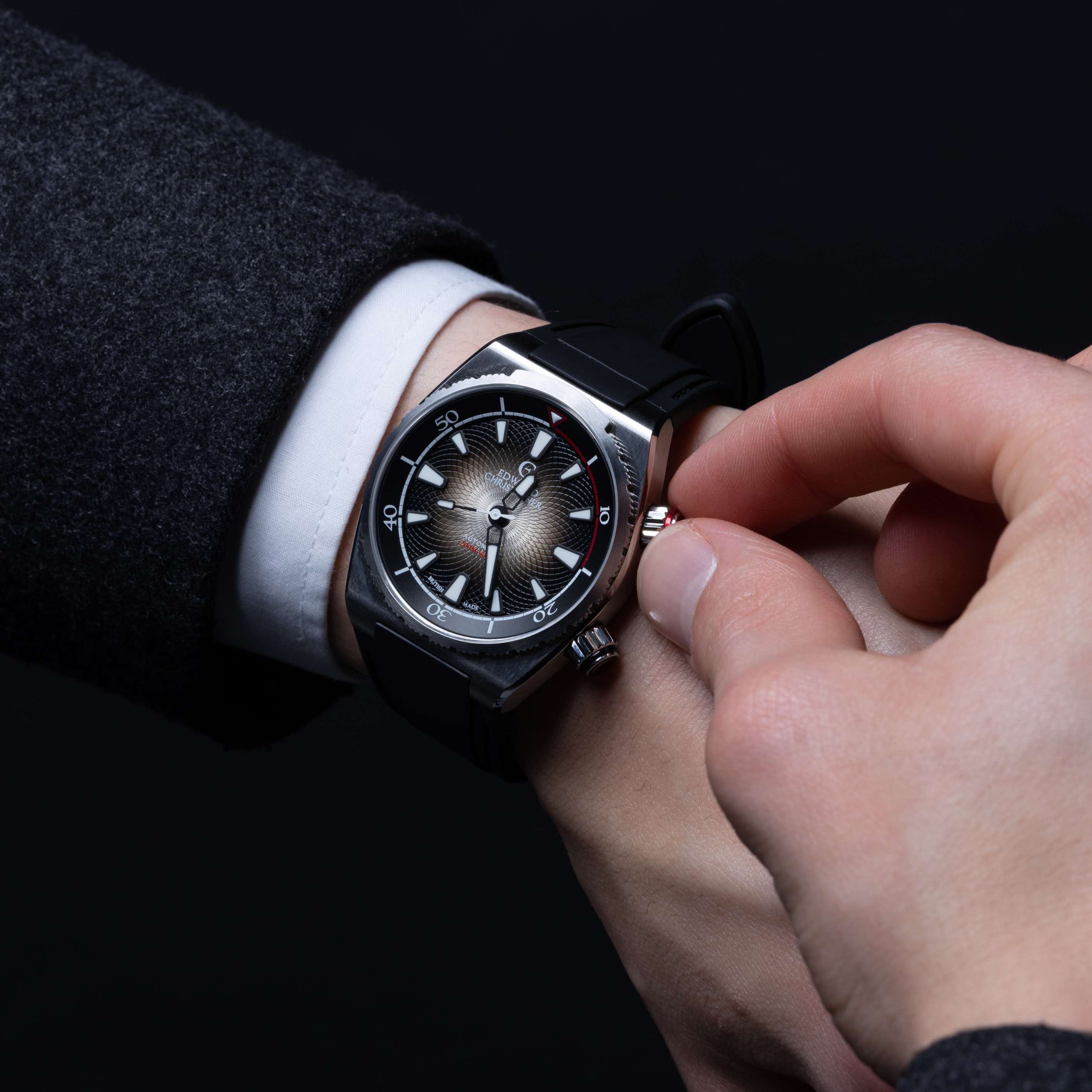 Fingers operating a Midnight Black colour watch bidirectional bezel from an Edward Christopher Manta luxury watch, dive watch & sports watch from Edward Christopher watch shop